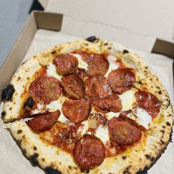 Cart Driver signature dishes The Cart-Driver Pizza (sausage, kale, mozzarella, chili), Daisy Pizza, Oysters, Tinned Seafood